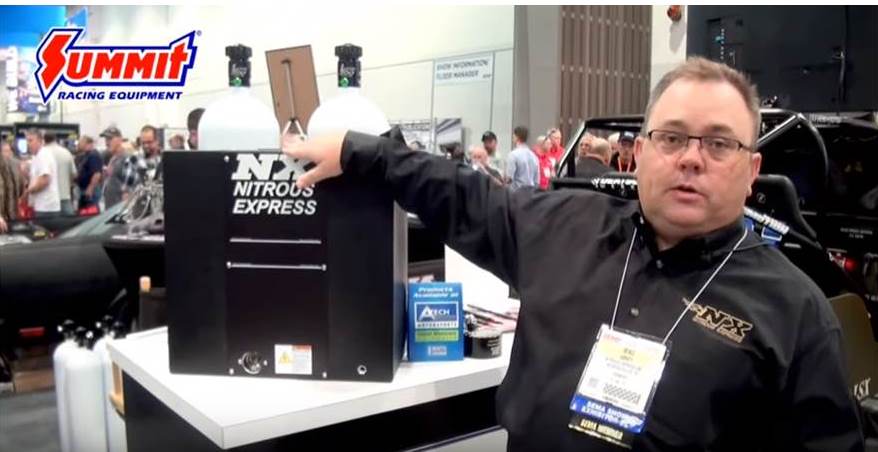man at nitrous express sema booth