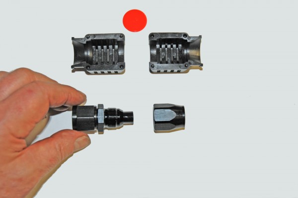 a specialty hose fitting with corresponding die
