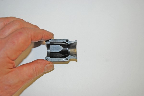 a hose fitting held by a man