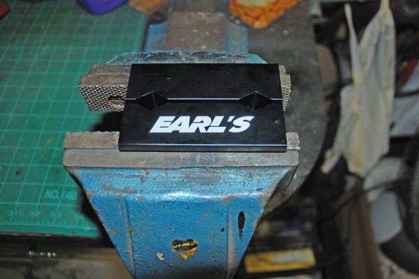 specialty aluminum jaws for AN hose and fittings in a bench vise