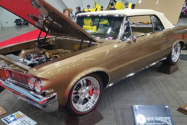 vintage Pontiac convertible at indoor car show