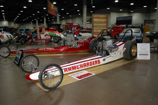 vintage front engine dragster slingshots at indoor car show