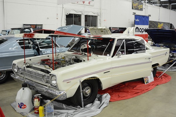 vintage white autocross racer at indoor car show