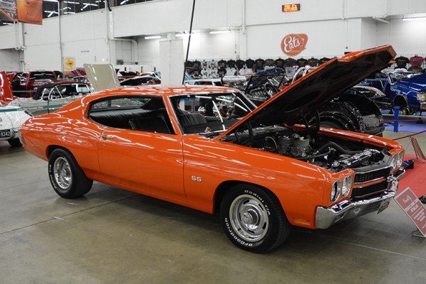 orange chevelle ss muscle car at indoor car show
