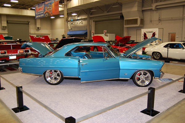 custom chevy 2 nova muscle car on display at indoor car show