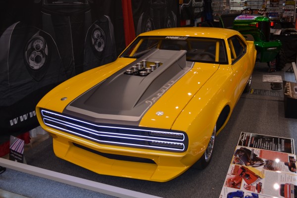 custom first gen chevy camaro at indoor car show