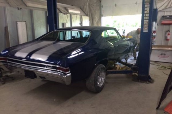 blue 1968 chevelle on lift during restoration