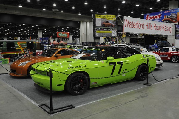late model dodge challenger in green race car livery