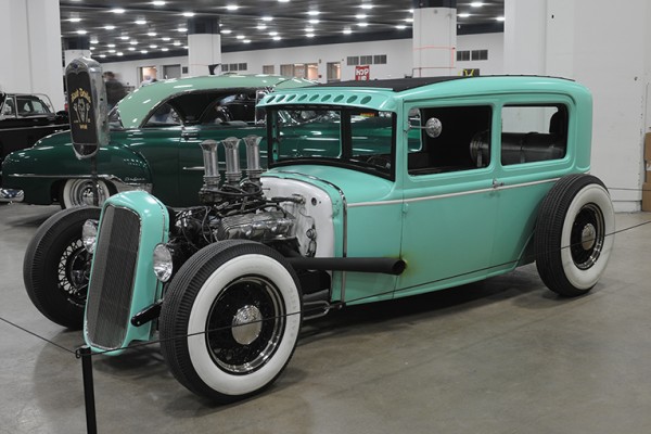 aqua green ford tudor hotrod coupe at indoor car show