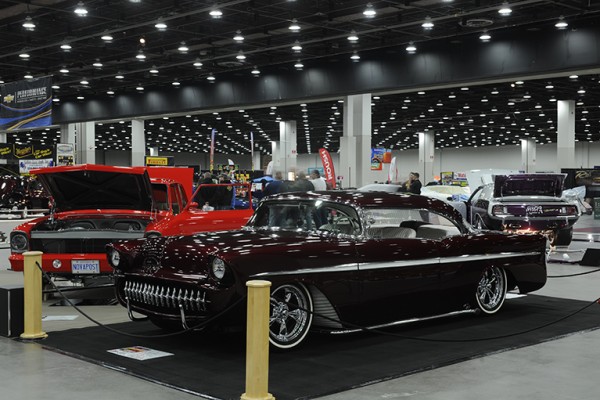 lowered custom coupe at indoor car show