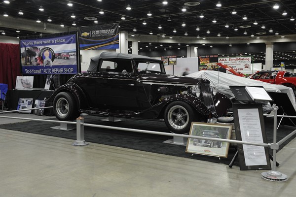 black vintage ford hotrod roadster at indoor car show