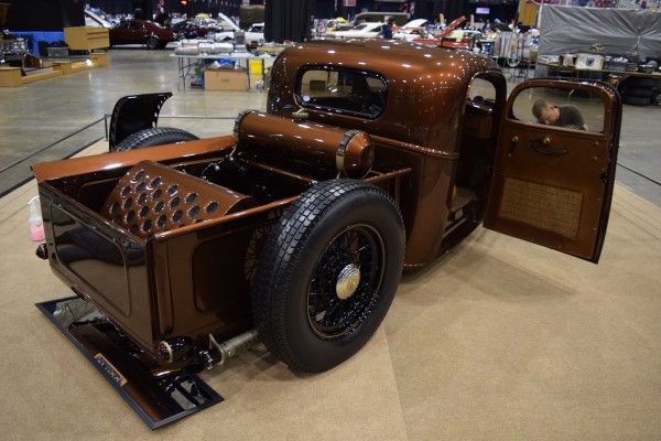 rear quarter view of a custom brown show truck