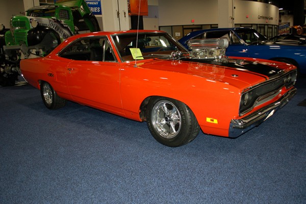 plymouth road runner with supercharged engine at car show