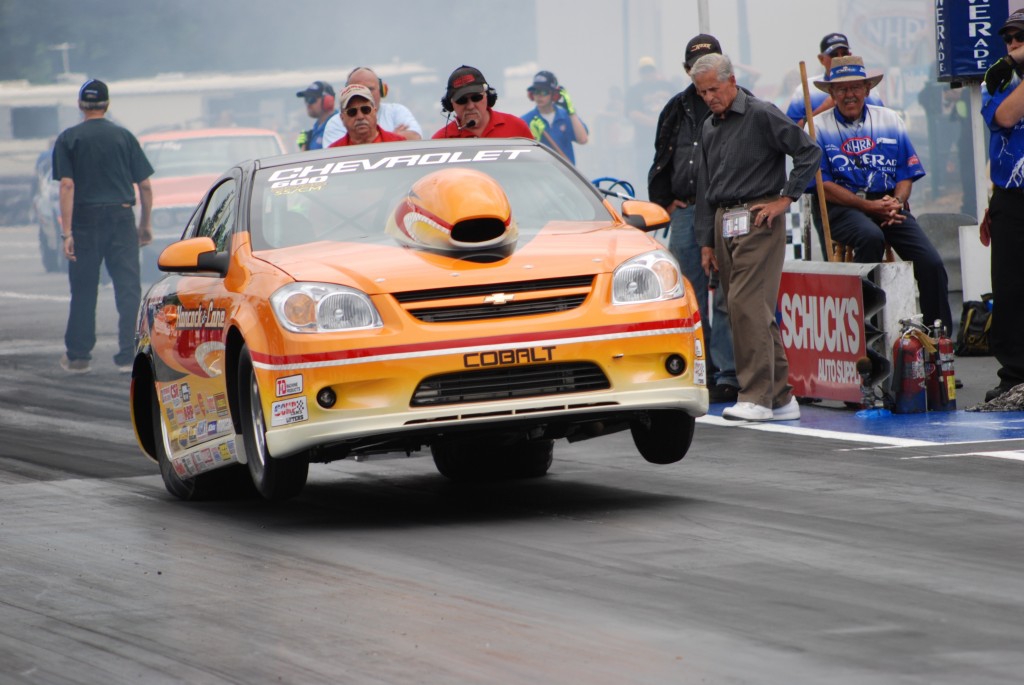 chevy cobalt drag race car launching at strip