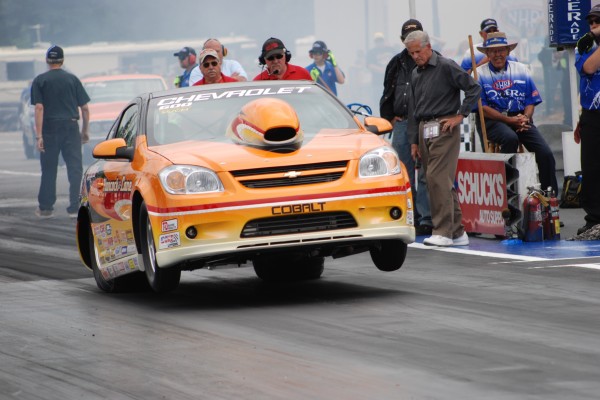 chevy cobalt drag race car launching at strip
