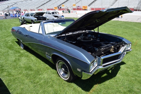 buick gs convertible at a car show