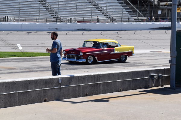 1955 chevy custom bel air driving on race car track
