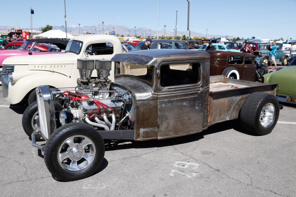 rat rod pickup truck at a car show