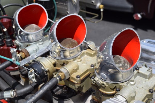 carburetor throats on a three deuce setup