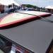 Surf board on the rood of a vintage hot rod thumbnail