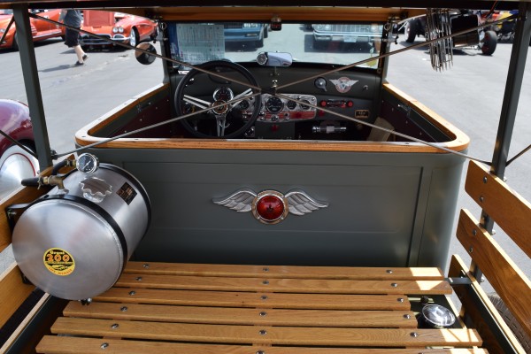 gas tank and customized wood floor of a hotrod