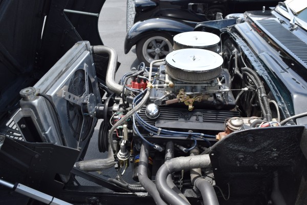 classic mopar engine in a hot rod with tilt front clip