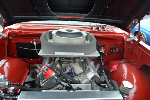 race engine under the hood of a vintage car