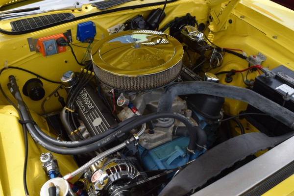 mopar small block v8 engine in an old muscle car