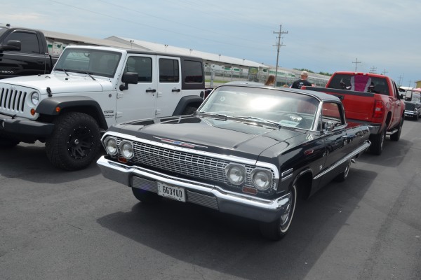 chevy impala coupe at a car show