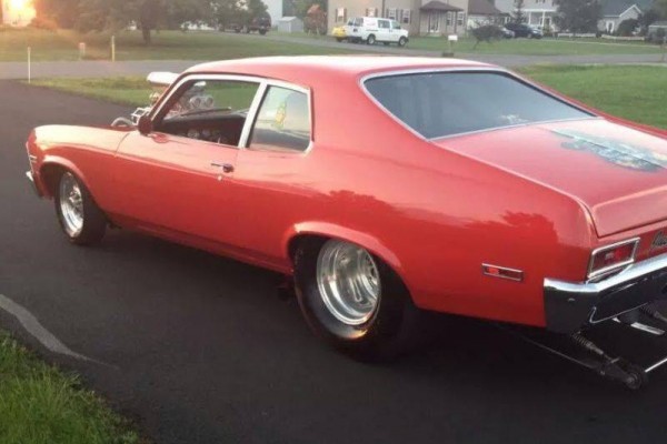 rear quarter view of a chevy nova drag car