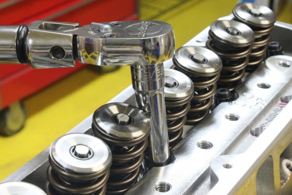 installing valve springs into a cylinder head