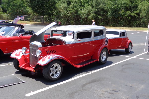 vintage ford hot rod at a car show