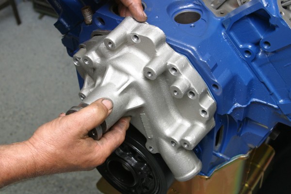 fitting a water pump onto an engine