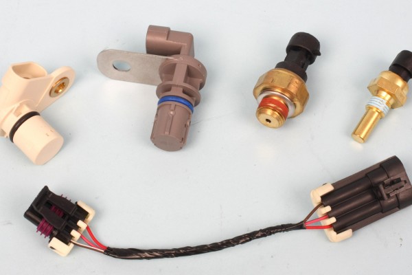 engine sensors and sending units on a table