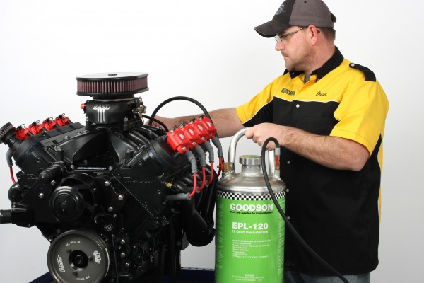 man pre-lubing a gm ls engine