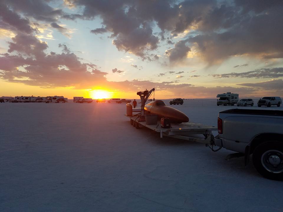 land speed cars at sunset on salt during Bonneville speed week