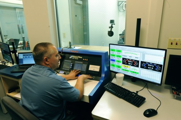 man controlling engine dyno
