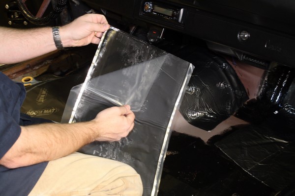 peeling of adhesive covering on boom mat car sound deadener