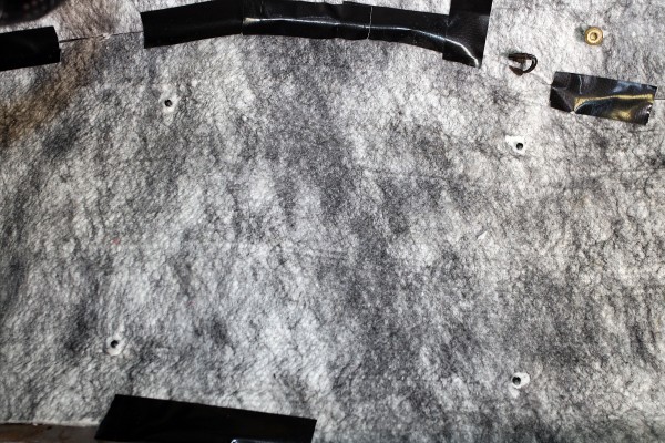 cutting seat mounting holes in automotive carpet