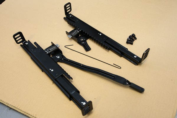 a pair of seat sliders for a camaro muscle car