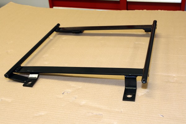 seat bracket for a camaro on a workbench