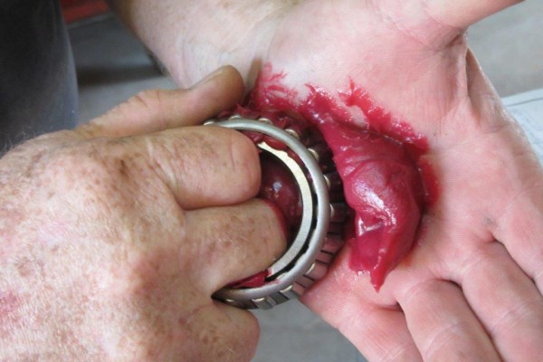 putting grease into a roller bearing