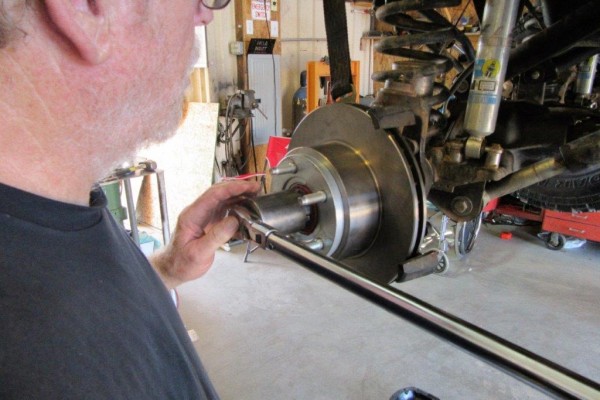 using a breaker bar on a large axle nut