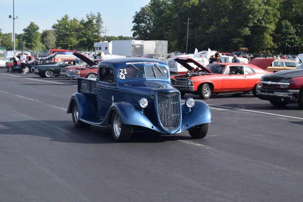 a vintage hotrod truck at a car show