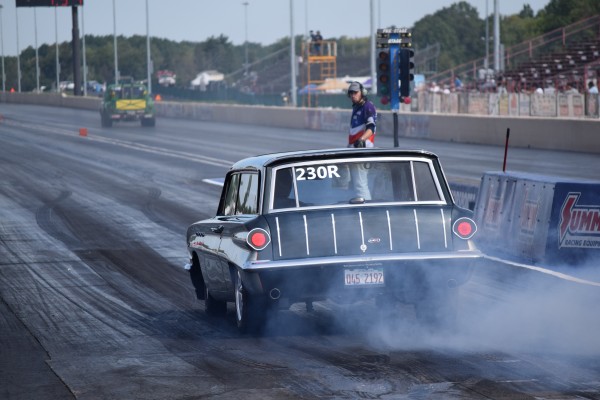 vintage station wagon launching at drag strip
