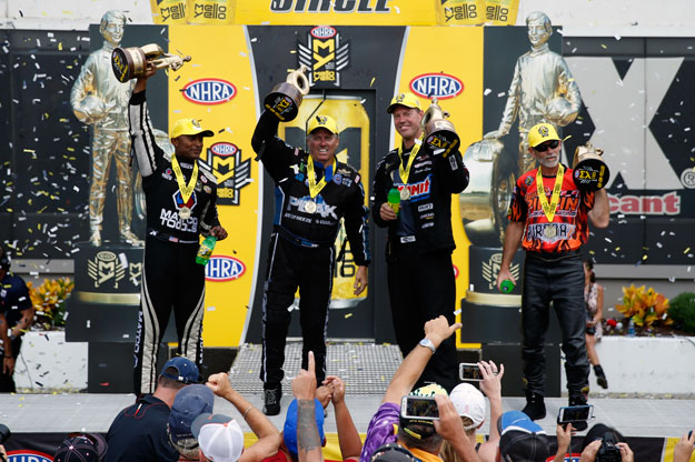 nhra winners cheering on stage after victory
