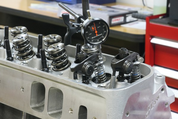 coil bind and valve spring clearance getting check on a cylinder head