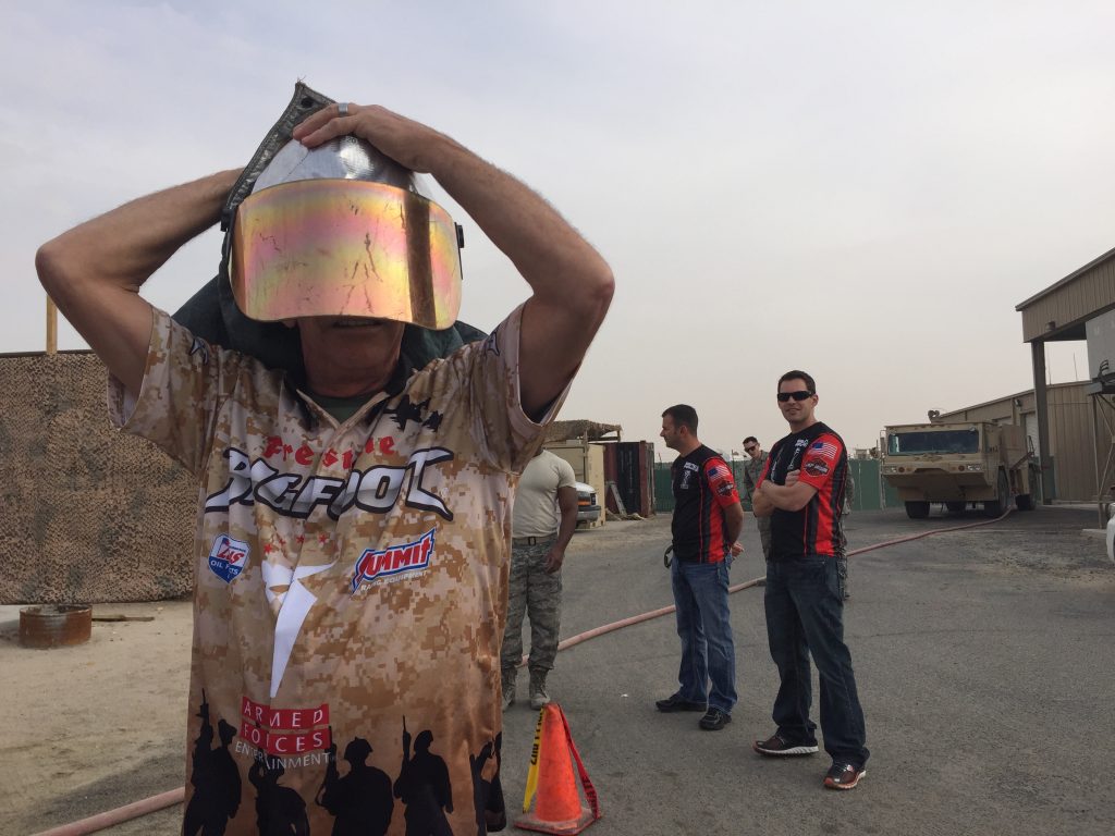man trying on military bomb disposal helmet