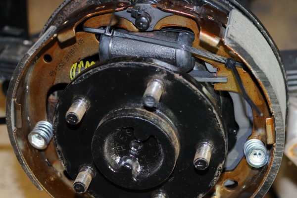 zip ties used to temporarily hold brake drum parts in place