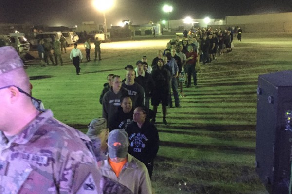 row of military troops waiting for an autograph